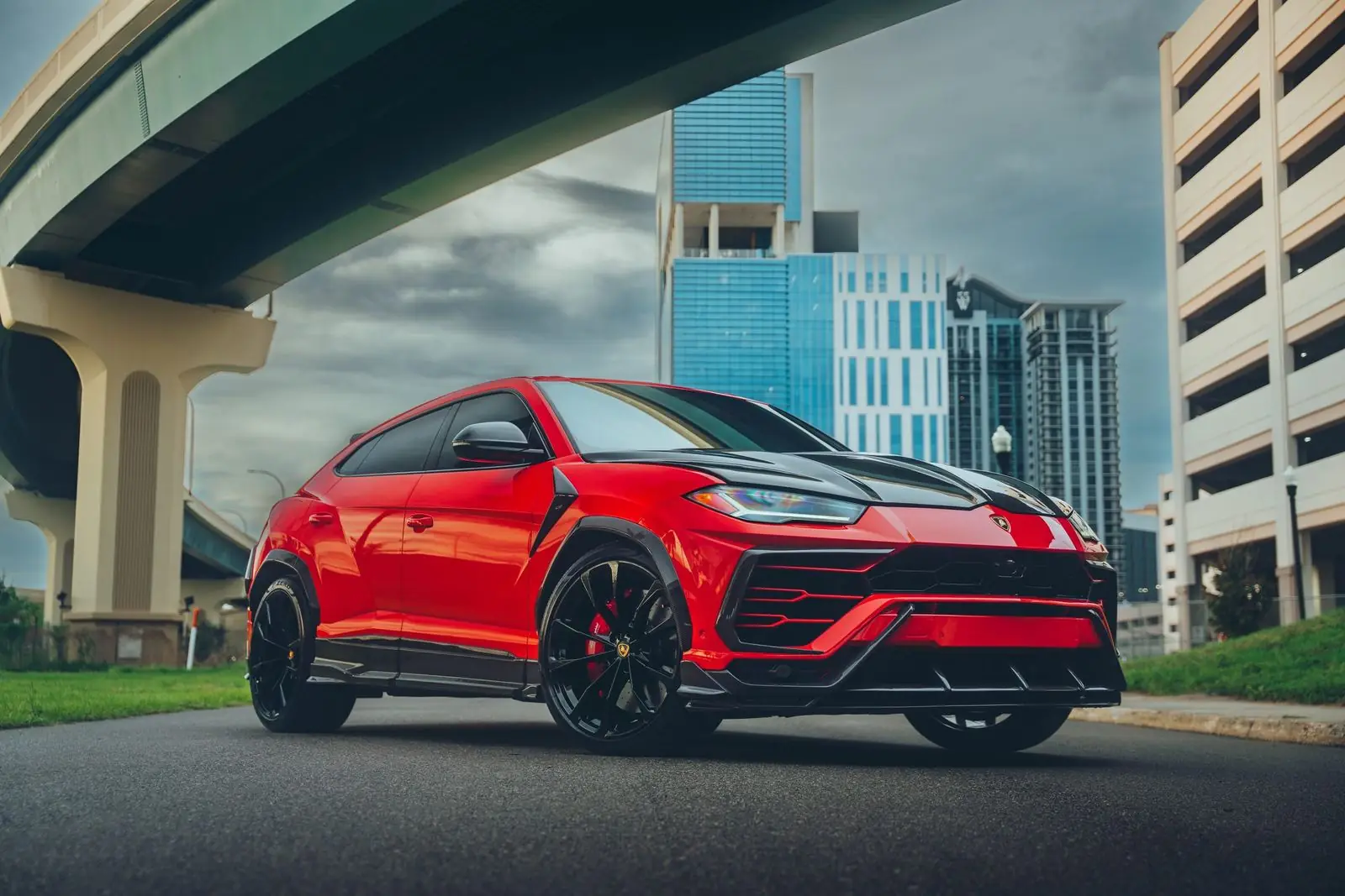 Red Lamborghini Urus available for exotic car rental under 21